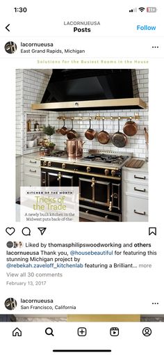 an image of a kitchen with white cabinets and gold accents on the wall above it