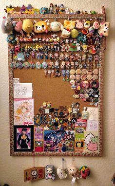 a bulletin board covered in lots of different kinds of pins and magnets on it