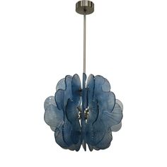 a blue glass flower hanging from a ceiling fixture