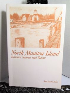 the front cover of north manitou island between sunrise and sunset