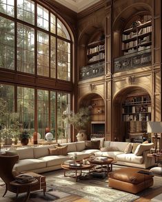 a large living room with lots of windows and couches in front of the bookshelves