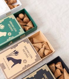 three boxes of wine corks sitting on top of a table