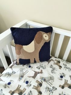 a pillow that is on top of a crib