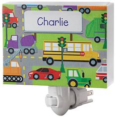 a children's night light with cars and trucks on it, that says charlie