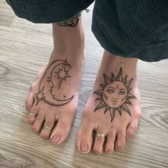 two feet with sun and moon tattoos on them