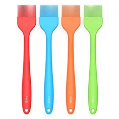 four different colored toothbrushes are lined up in the same row on a white background