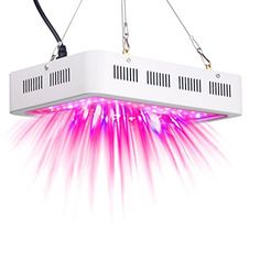 a pink and white light fixture hanging from a ceiling with wires attached to the side