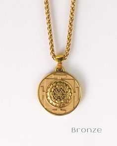 This is a Sri Yantra necklace, a handmade jewelry. This unisex necklace is the perfect gift for him and her any time of the year  Unlock the power of divine geometry and embrace spiritual enlightenment with our handmade Sri Yantra necklace. Immerse yourself in the sacred symbol's profound energy as you embark on a journey of self-discovery and cosmic connection. Handmade with meticulous care and attention to detail, each necklace is a unique expression of spiritual artistry. The Sri Yantra, know Divine Geometry, Cosmic Connection, Mandala Jewelry, Sri Yantra, Bronze Necklace, Chakra Necklace, Sacred Symbols, Unisex Necklace, Spiritual Enlightenment