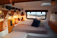 a bed sitting inside of a bedroom next to a window