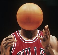 a basketball player is about to throw the ball up in the air with his hands