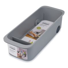 a grey plastic container with a magazine holder