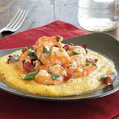 the omelet is topped with shrimp and bacon