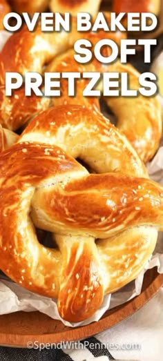 several baked soft pretzels on a plate with text overlay that reads oven baked soft pretzels