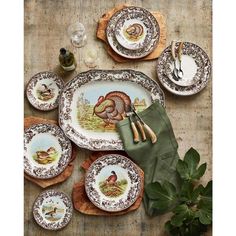 an assortment of turkey plates and place settings