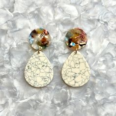 Life is sweeter in our teardrop earrings crafted from a gray and beige crackle acrylic with a complementary light multicolor stud. A sweet addition to any look you crave.  Designed for Closet Rehab. Handmade in Pittsburgh, PA. Made in the USA. Materials: acrylic, brass base posts/jump rings with 18k gold plating Hypoallergenic  Our accessories are handcrafted from colorful acrylic. To preserve your Closet Rehab products, we recommend storing safely in our pouches. Avoid contact with harsh substances like perfumes and hairsprays. Items with plated metals naturally tarnish over time when exposed to body oils and other natural elements. Please handle with care, as excessive dropping, wear and tear, and improper transport can contribute to damage over time. Cleaning - Use dry cloth, preferably Alphabet Jewelry, Mini Hoop Earrings, Stocking Fillers For Her, Acrylic Jewellery, Forever Jewelry, Earring Crafts, Jewelry Ring Box, Pet Gift, Grey And Beige