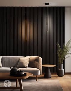 a living room filled with furniture next to a wooden table and wall mounted light fixture