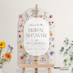 an easel with flowers and the words welcome to the bridal shower