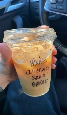 someone holding up a plastic cup with liquid in it that says you're literally swip a babble