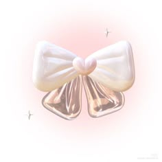 a white bow on top of two shiny silver objects with stars in the sky behind it