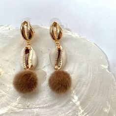 #cowrie #cowriestudearrings #studearring #dangleearrings #beadedearrings Pom Pom Earrings, Cowrie Shells, Cowrie Shell, Beaded Earrings, Pom Pom, Shells, Dangle Earrings, Pearl Earrings, Stud Earrings