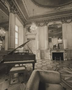 a grand piano in an ornate room with chandelier