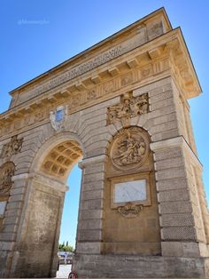 an old stone arch with carvings on it