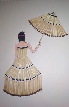 a woman in a dress with an umbrella made out of straws on the wall