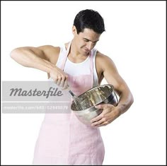 a man in an apron holding a metal bowl