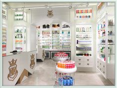 the inside of a store with many bottles and shelves