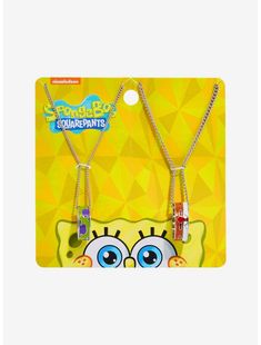 two necklaces with cartoon characters on them in front of a yellow and white background