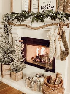 a fireplace decorated with christmas decorations and stockings