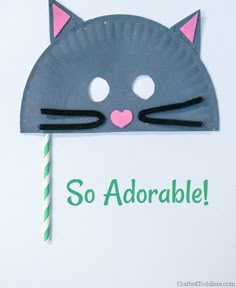 a paper plate with a cat's head on it and the words so adorable