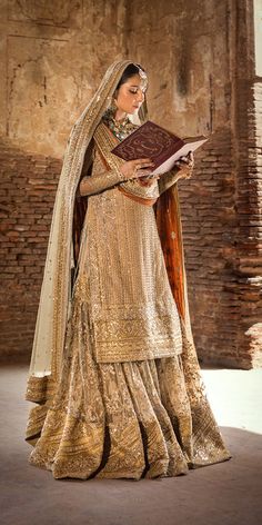 Golden Gharara Kameez Dupatta Pakistani Wedding Dress is a perfectly stitched attire adorned with Embroidery and lavish details of Shimmering goldwork. Golden Gharara, Gharara Pakistani, Garara Dress, Bridal Gharara, Gharara Designs, Nikah Dress, Pakistani Designer Clothes, Pakistani Formal Dresses, Wedding Lehenga Designs