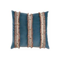 a blue pillow with orange fringes on it