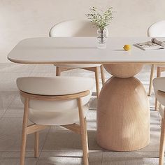 a white table with four chairs around it