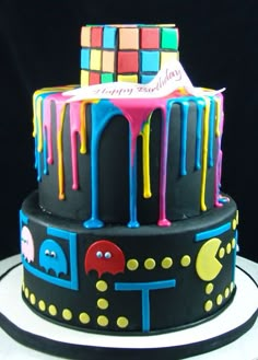 a birthday cake decorated with colorful icing and decorations