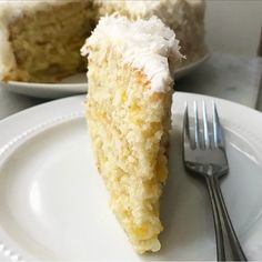 a piece of cake on a plate with a fork next to it and another slice in the background