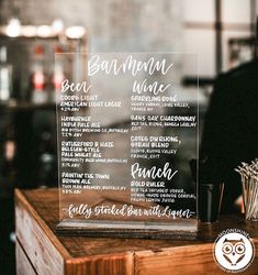 a menu board sitting on top of a wooden table