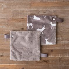 two gray and white deer print baby blankets