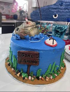 there is a cake that has been made to look like a fishing boat on it