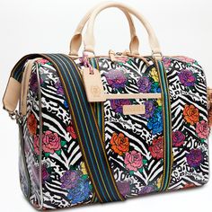 This spacious and colorful duffel is the perfect carry-on for a weekend getaway, making a statement with functionality, durability, and style. Topped with natural leather handles and an adjustable webbing strap, the Jetsetter is crafted to hold its shape and makes traveling easy with ample interior storage and functional pockets. Carla ConsuelaCloth™ exterior Double-zip closure Interior slide pocket and zipper pocket Two exterior slide pockets Includes detachable and adjustable woven crossbody s Designer Travel Duffle Bag, Designer Tote Luggage For Everyday Use, Designer Everyday Tote Luggage, Luxury Multicolor Satchel For Travel, Designer Travel Bag With Luggage Sleeve For On-the-go, Designer Multicolor Satchel For Travel, Designer Travel Tote Weekender Bag, Leather Handled Tote Luggage For Trips, Tote Luggage With Leather Handles For Trips