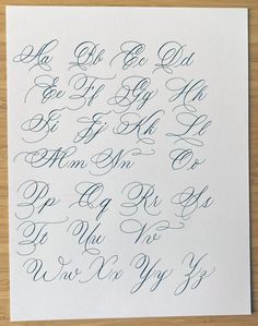 the upper and lower letters are in cursive writing with black ink on white paper