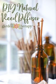 a bottle filled with reed diffuser sitting on top of a table