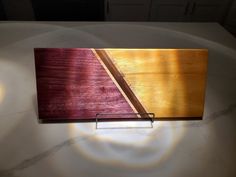 a piece of wood that is on top of a table with light coming through it