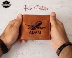 This leather long bifold wallet is the perfect gift for Air Force staff, pilots, or cabin crew. Crafted from premium leather, it offers a sleek design with plenty of space for cards and cash. Personalize it with initials or aviation-themed motifs to create a unique and thoughtful gift for aviation professionals. - ✈️ Leather long bifold wallet for men, ideal for pilots and cabin crew - Customizable with initials or aviation-themed designs - Made from premium leather for durability and a timeless look - Features multiple card slots, cash compartments, and a slim profile - Perfect for Air Force staff or aviation enthusiasts - Great gift for birthdays, promotions, or special occasions - Elegant and practical, ideal for everyday use or travel - A must-have accessory for any aviation profession Mens Air Force, Custom Leather Wallet, Personalized Leather Wallet, Staff Gifts, Pilot Gifts, Wallet For Men, Cabin Crew, Money Clip Wallet, Leather Pieces