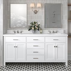 a bathroom with two sinks and mirrors on the wall next to a tiled floor that has black and white tiles