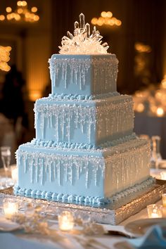 a three - tiered cake with icing on the top is sitting on a table