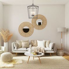 a living room filled with white furniture and lots of pillows on top of it's couches