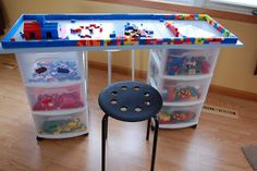 the lego desk is set up with plastic drawers and toy storage bins for children's toys