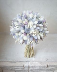 a bouquet of flowers sitting on top of a table